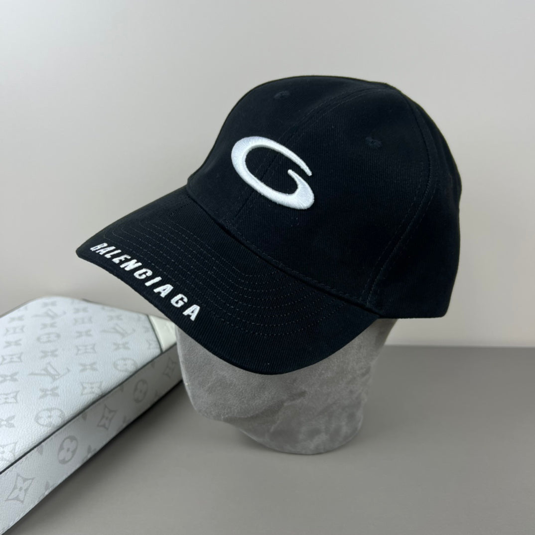 Black cotton cap with white oval emblem embroidery